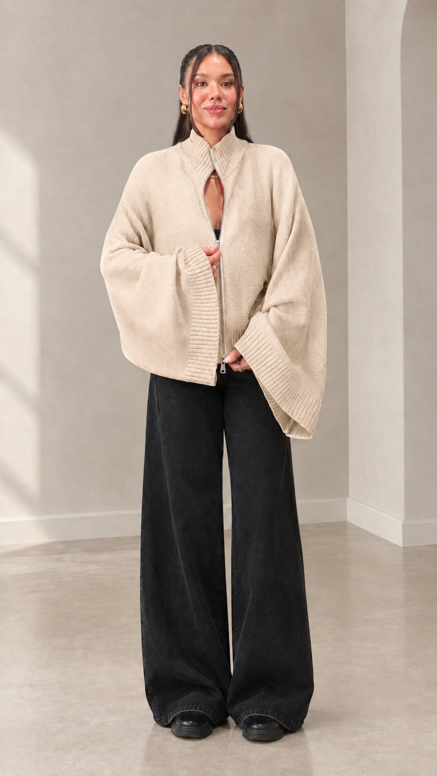 Woman wearing cream beige batwing sleeve zip cardigan