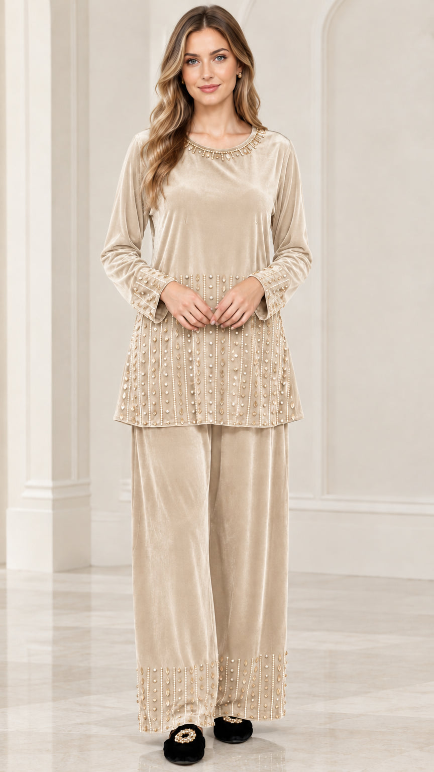 Front view of woman wearing champagne beige embellished velvet tunic and pants set