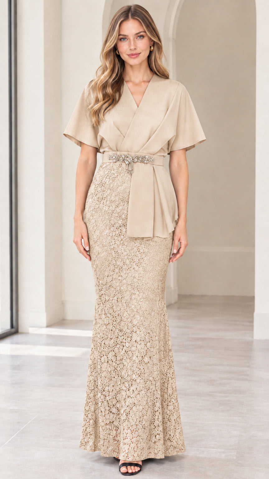 Front full-length view of model wearing champagne beige flutter sleeve lace maxi dress