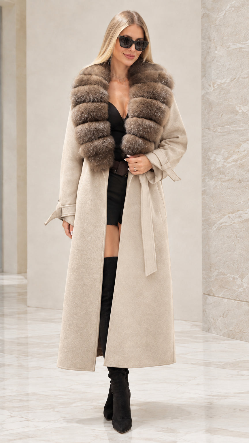 Front full view of woman wearing beige cream longline trench coat with faux fur collar