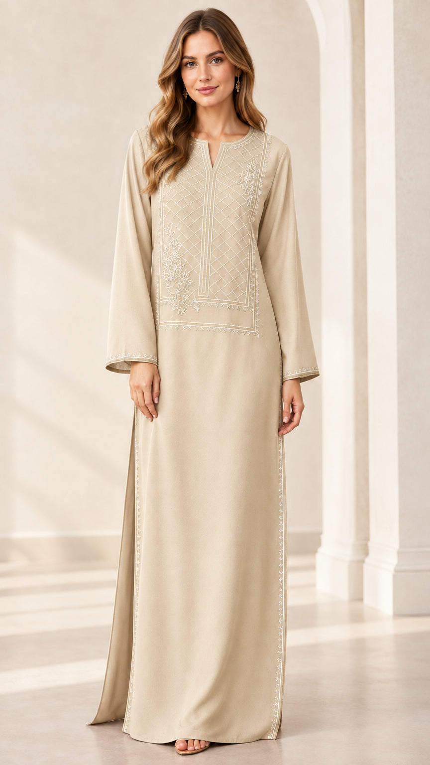 Front full view of woman wearing beige embroidered kaftan maxi dress
