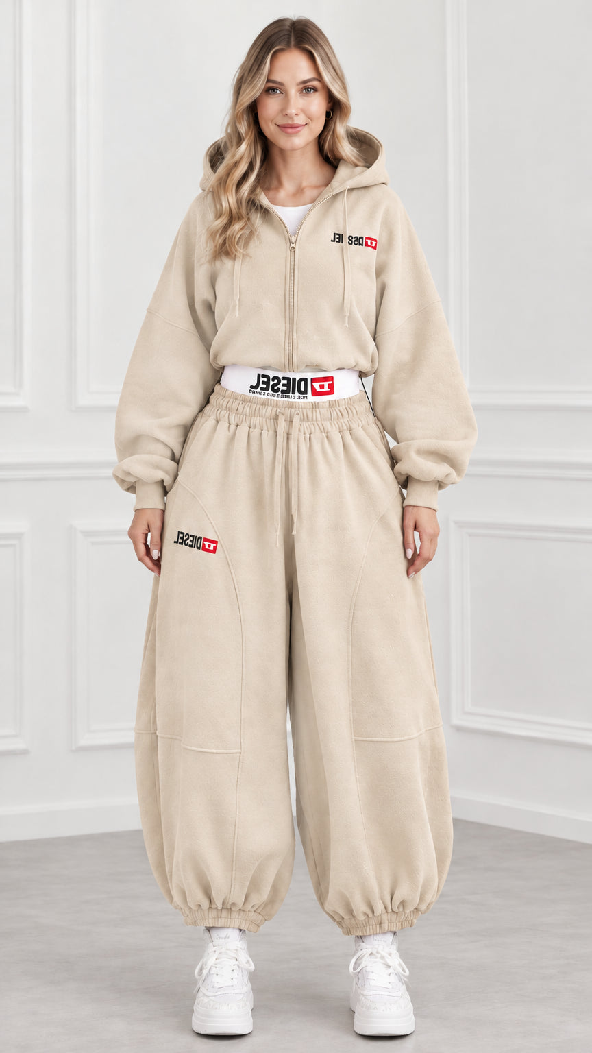 Front view of model wearing beige cropped hoodie and balloon joggers set