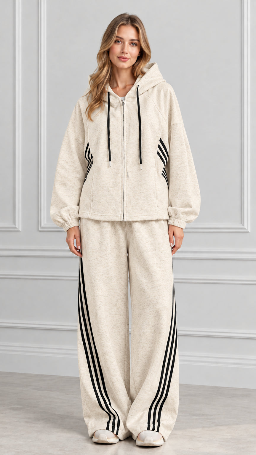 Front view of woman wearing Oatmeal beige zip-up hoodie and wide-leg striped pants set