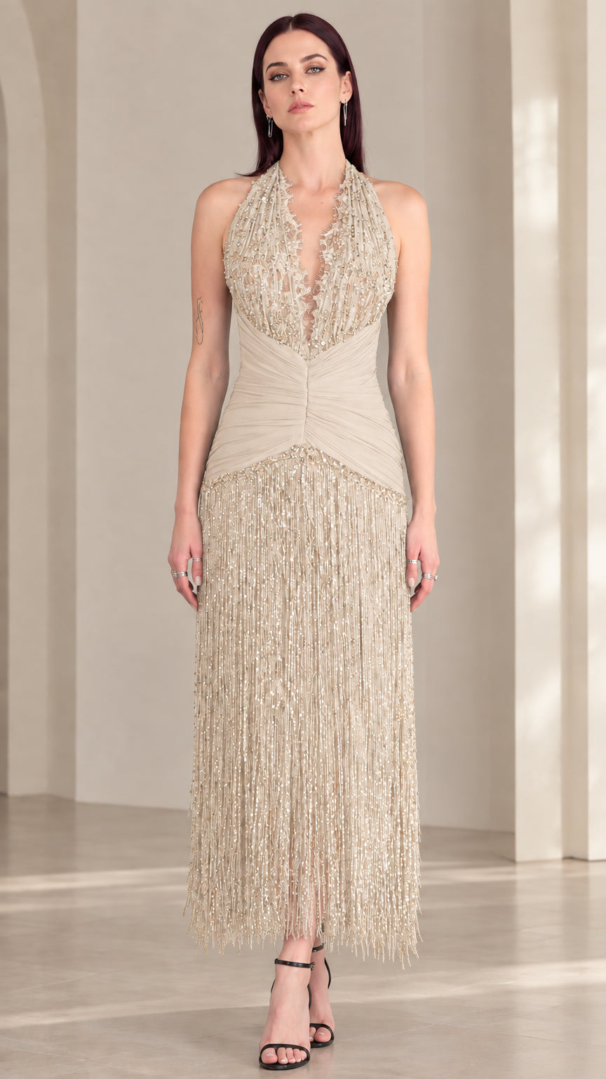Front view of champagne beige halter sequin fringe evening dress
