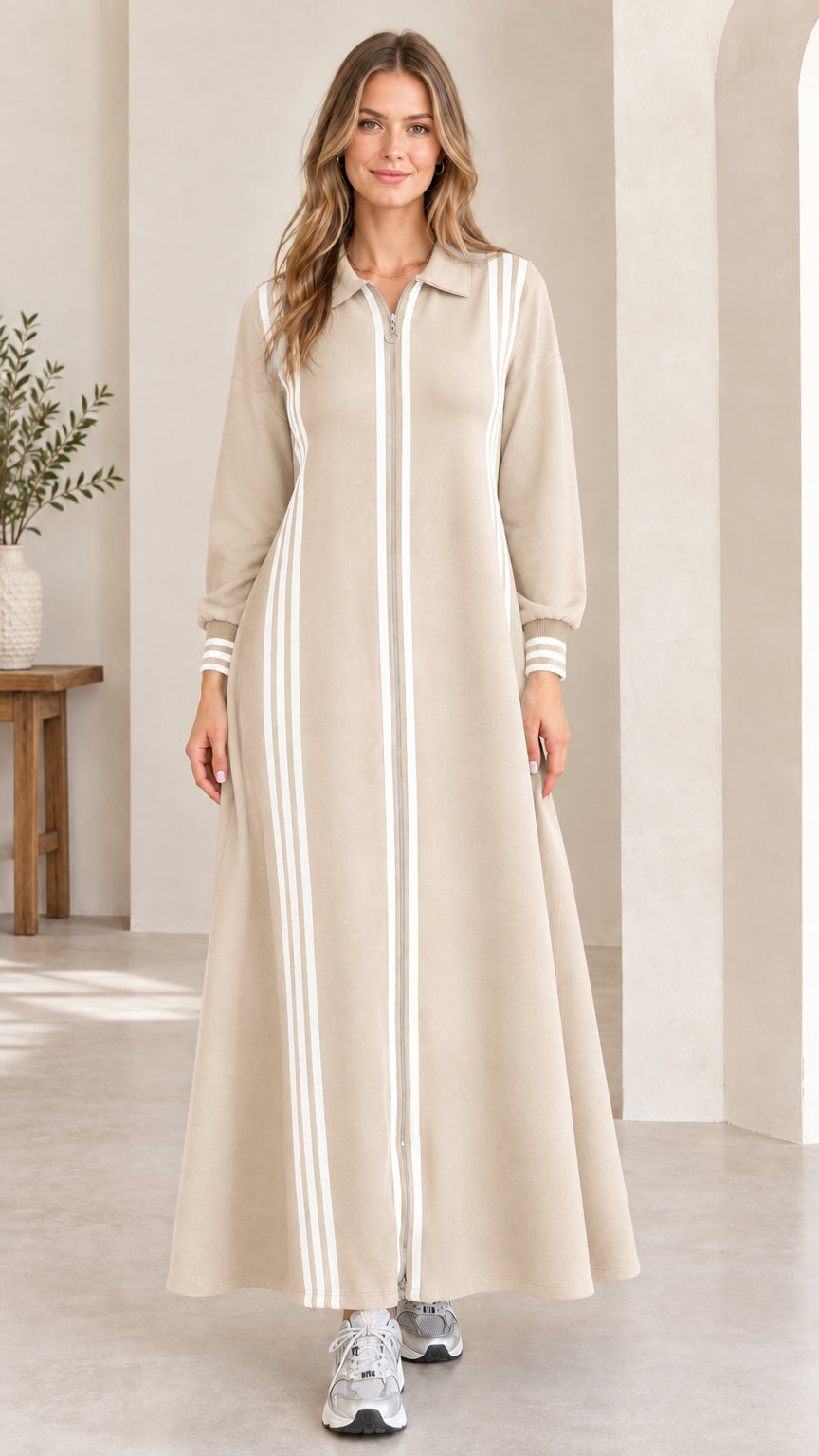 Front view of beige cream striped zip-front long sleeve maxi track dress