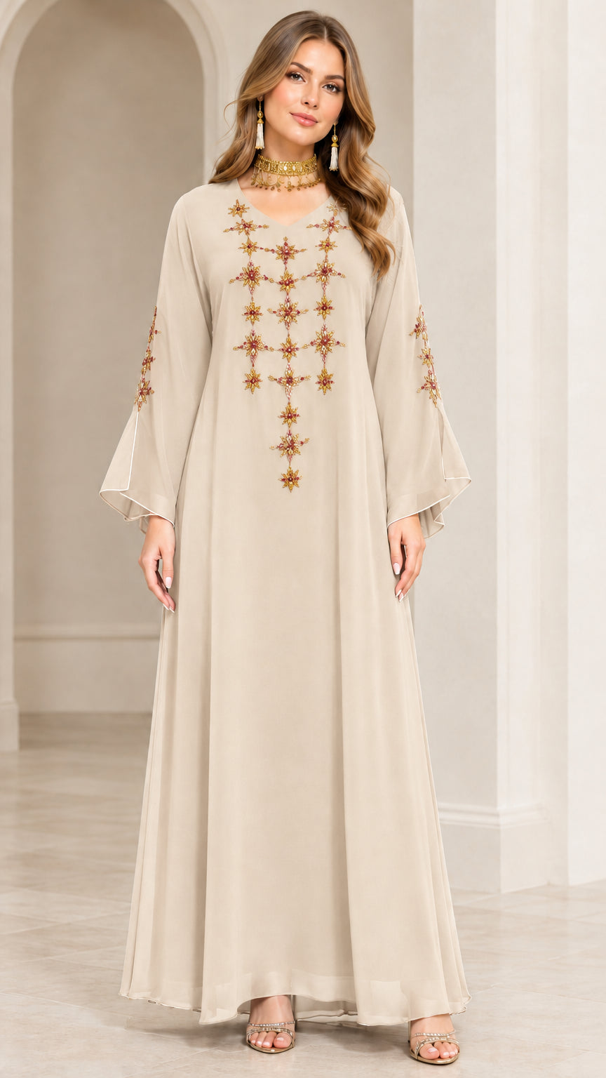 Full-length front view of model wearing Champagne cream embroidered maxi abaya dress