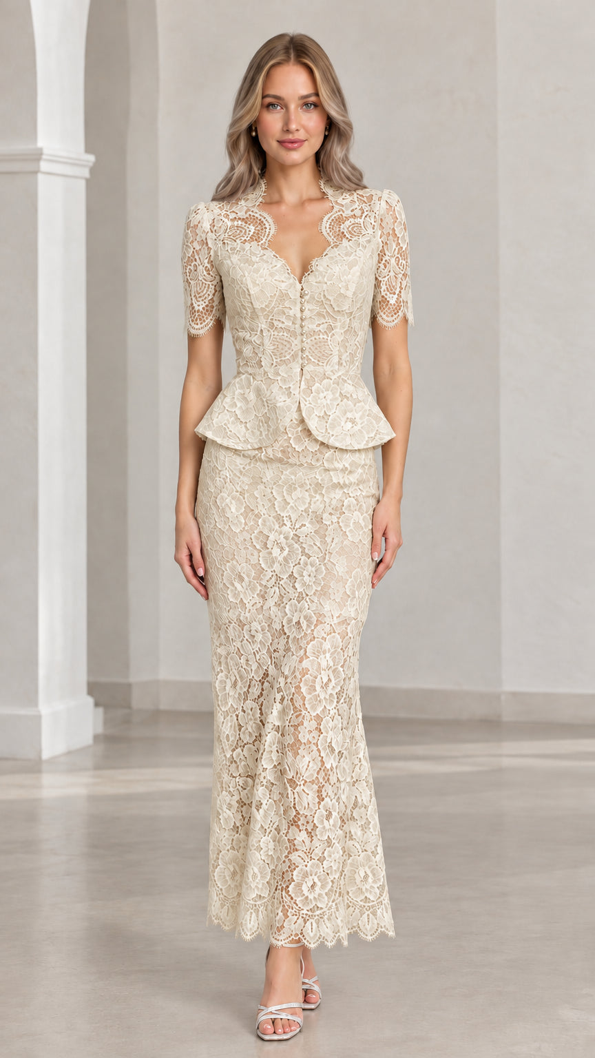 Front view of woman wearing champagne floral lace peplum maxi two-piece set